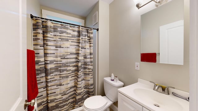 17 Wellman St, Lewiston, ME 04240 - full bathroom with toilet, vanity, and a shower with curtain