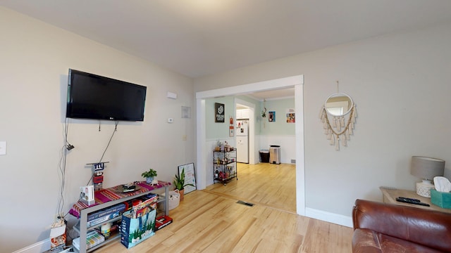17 Wellman St, Lewiston, ME 04240 - living area featuring wood finished floors and baseboards