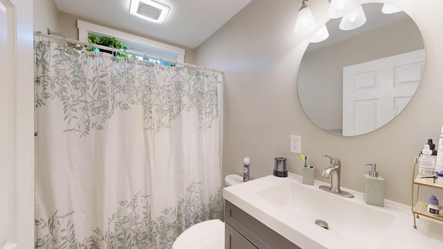 17 Wellman St, Lewiston, ME 04240 - full bathroom with toilet, vanity, curtained shower, and a chandelier