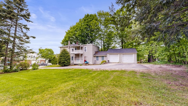17 Wellman St, Lewiston, ME 04240 - view of front of home with a garage, a front yard, asphalt driveway, and a chimney