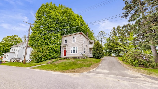17 Wellman St, Lewiston, ME 04240 - view of property with a chimney and a front lawn