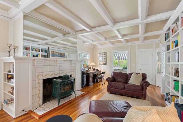 71 N St, Kennebunkport, ME 04046 - living room featuring coffered ceiling, light wood-style flooring, a wood stove, and beamed ceiling