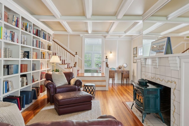 71 N St, Kennebunkport, ME 04046 - sitting room with stairway, coffered ceiling, beam ceiling, hardwood / wood-style flooring, and a wood stove