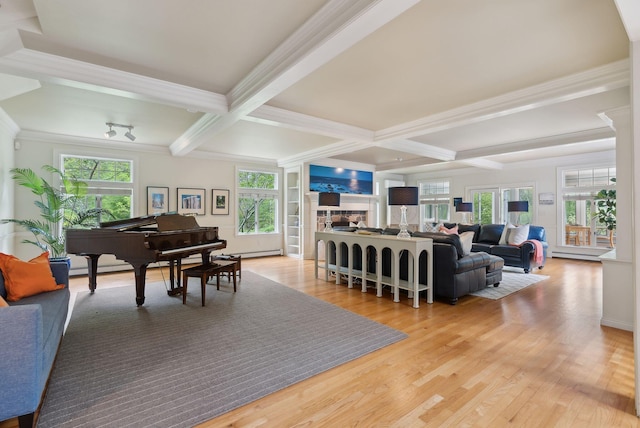 71 N St, Kennebunkport, ME 04046 - living room featuring beamed ceiling, coffered ceiling, light wood-style flooring, crown molding, and a fireplace