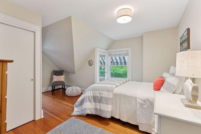 71 N St, Kennebunkport, ME 04046 - bedroom featuring wood finished floors and vaulted ceiling