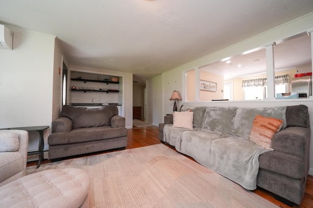 22 Meadow Rd, Hampden, ME 04444 - living room featuring wood finished floors and a baseboard radiator