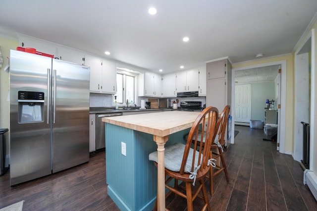 22 Meadow Rd, Hampden, ME 04444 - kitchen featuring stainless steel appliances, under cabinet range hood, dark wood finished floors, white cabinetry, and recessed lighting