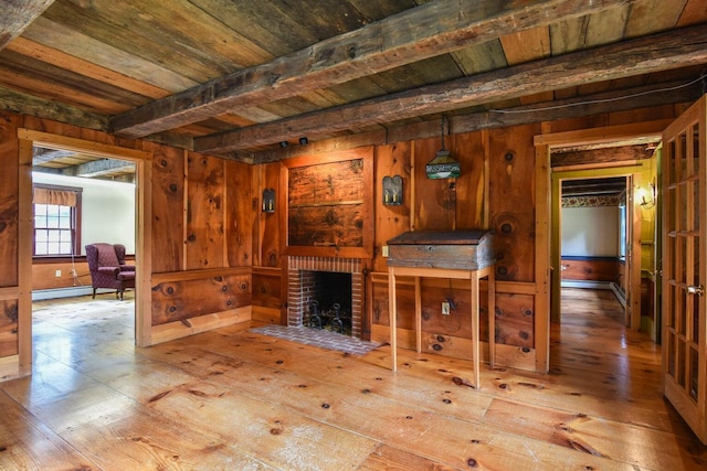 306 Campbell Rd, Leeds, ME 04263 - unfurnished living room with hardwood / wood-style flooring, wood ceiling with exposed beams, wood walls, a fireplace, and a baseboard heating unit