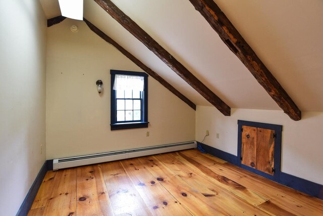 306 Campbell Rd, Leeds, ME 04263 - additional living space with baseboard heating, light wood-type flooring, and baseboards