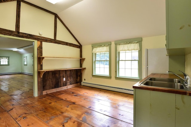 306 Campbell Rd, Leeds, ME 04263 - kitchen with baseboard heating, hardwood / wood-style floors, freestanding refrigerator, a sink, and lofted ceiling