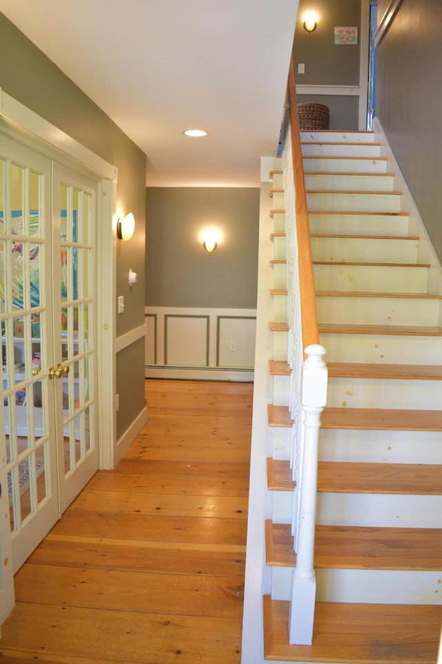 306 Campbell Rd, Leeds, ME 04263 - staircase featuring french doors, wood-type flooring, baseboard heating, and recessed lighting