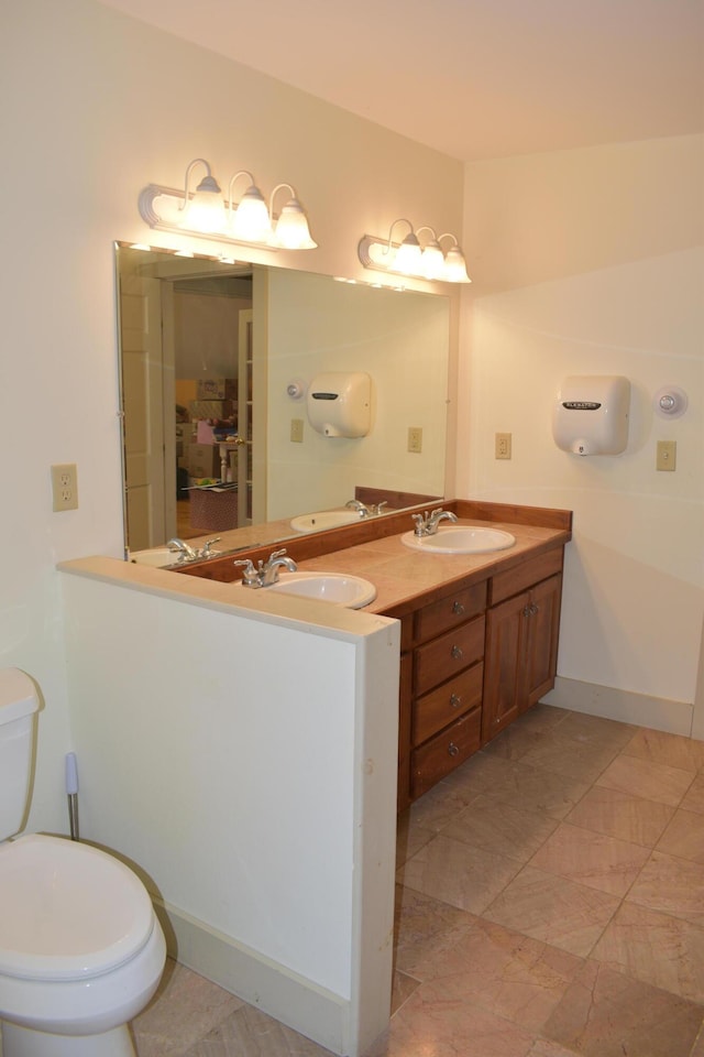306 Campbell Rd, Leeds, ME 04263 - bathroom featuring toilet and double vanity