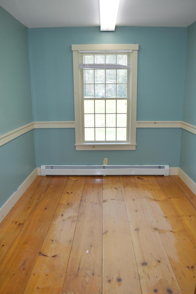 306 Campbell Rd, Leeds, ME 04263 - unfurnished room featuring hardwood / wood-style floors, healthy amount of natural light, and baseboards