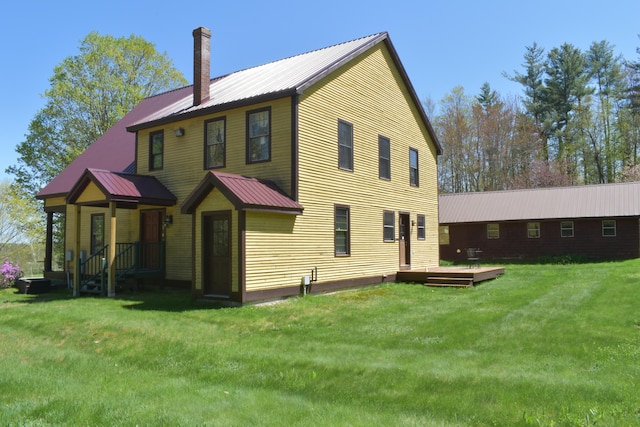306 Campbell Rd, Leeds, ME 04263 - back of house with a chimney, a lawn, metal roof, and a deck