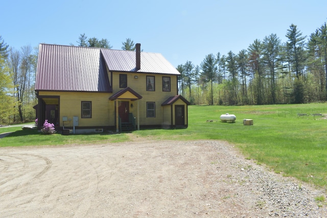 306 Campbell Rd, Leeds, ME 04263 - view of front of house with a front yard, metal roof, and dirt driveway