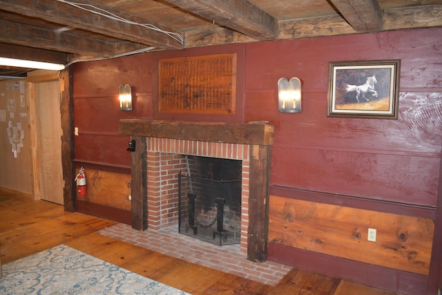 306 Campbell Rd, Leeds, ME 04263 - living room with beam ceiling, a brick fireplace, and hardwood / wood-style flooring