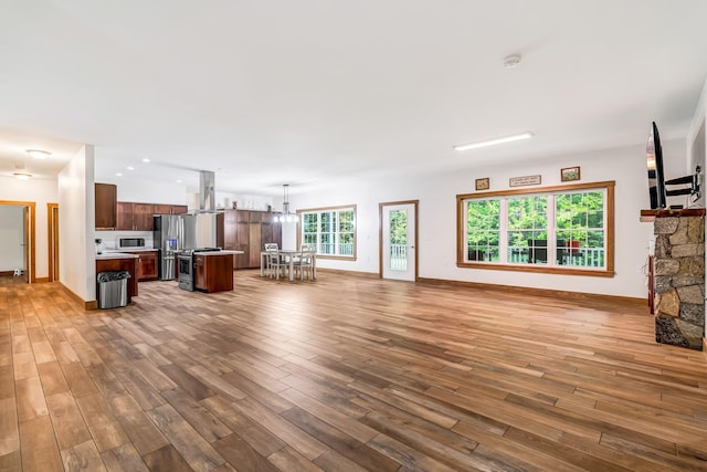 66 Mcnally Rd, Clinton, ME 04927 - unfurnished living room with wood finished floors and baseboards