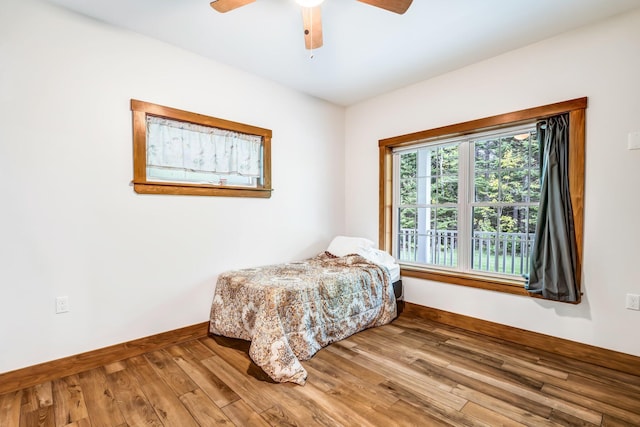 66 Mcnally Rd, Clinton, ME 04927 - bedroom featuring baseboards, wood finished floors, and ceiling fan