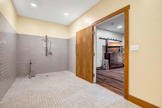 66 Mcnally Rd, Clinton, ME 04927 - bathroom with a tile shower, tile patterned floors, and recessed lighting
