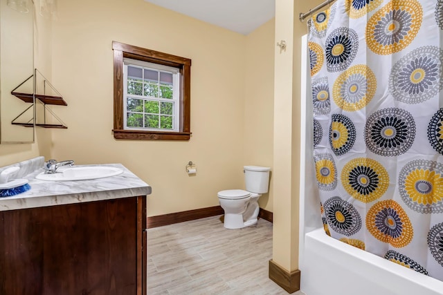66 Mcnally Rd, Clinton, ME 04927 - bathroom with baseboards, vanity, toilet, and shower / bath combo
