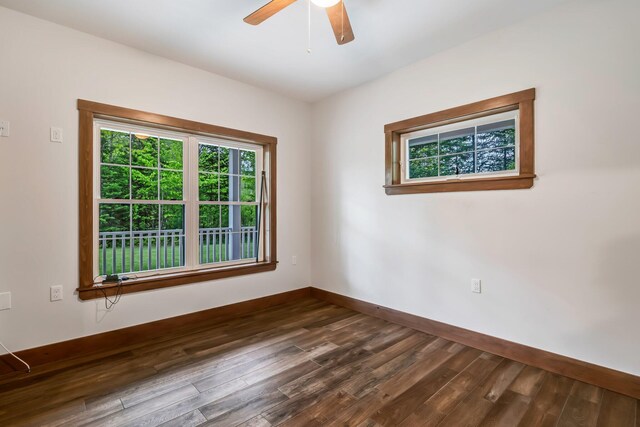 66 Mcnally Rd, Clinton, ME 04927 - spare room featuring baseboards, dark wood-type flooring, and ceiling fan