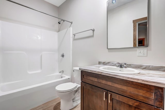 66 Mcnally Rd, Clinton, ME 04927 - bathroom with vanity, toilet, shower / bathtub combination, and wood finished floors