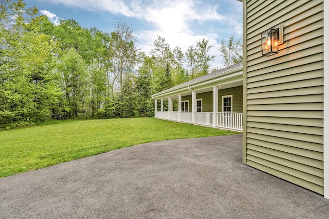 66 Mcnally Rd, Clinton, ME 04927 - view of grassy yard with a patio