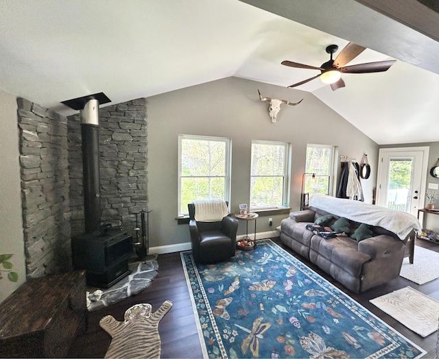 208 New Rd, Arundel, ME 04046 - living room with a wood stove, ceiling fan, dark wood-style floors, plenty of natural light, and vaulted ceiling