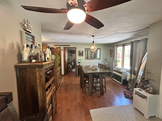 208 New Rd, Arundel, ME 04046 - dining room featuring wood finished floors, a textured ceiling, and a ceiling fan