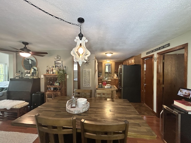 208 New Rd, Arundel, ME 04046 - dining room with a textured ceiling, a ceiling fan, and dark wood-style flooring