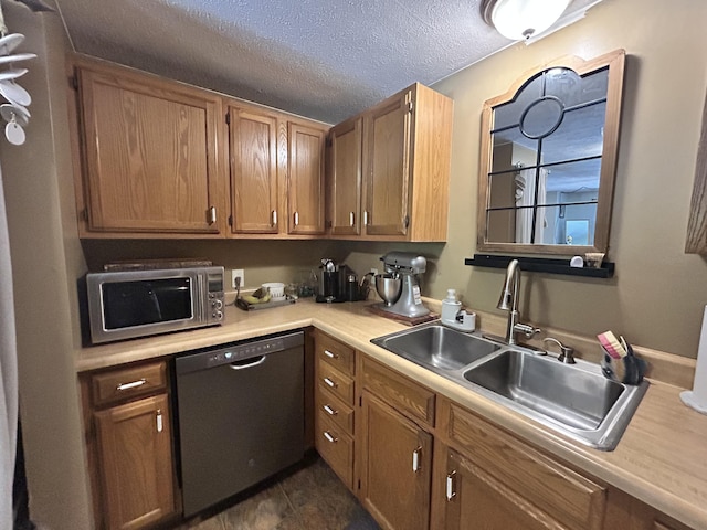 208 New Rd, Arundel, ME 04046 - kitchen featuring dishwashing machine, a sink, stainless steel microwave, light countertops, and a textured ceiling