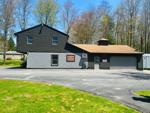 208 New Rd, Arundel, ME 04046 - split level home featuring driveway