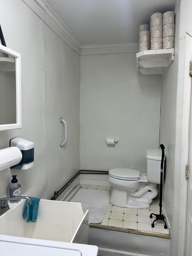 208 New Rd, Arundel, ME 04046 - half bathroom with toilet, a sink, and crown molding