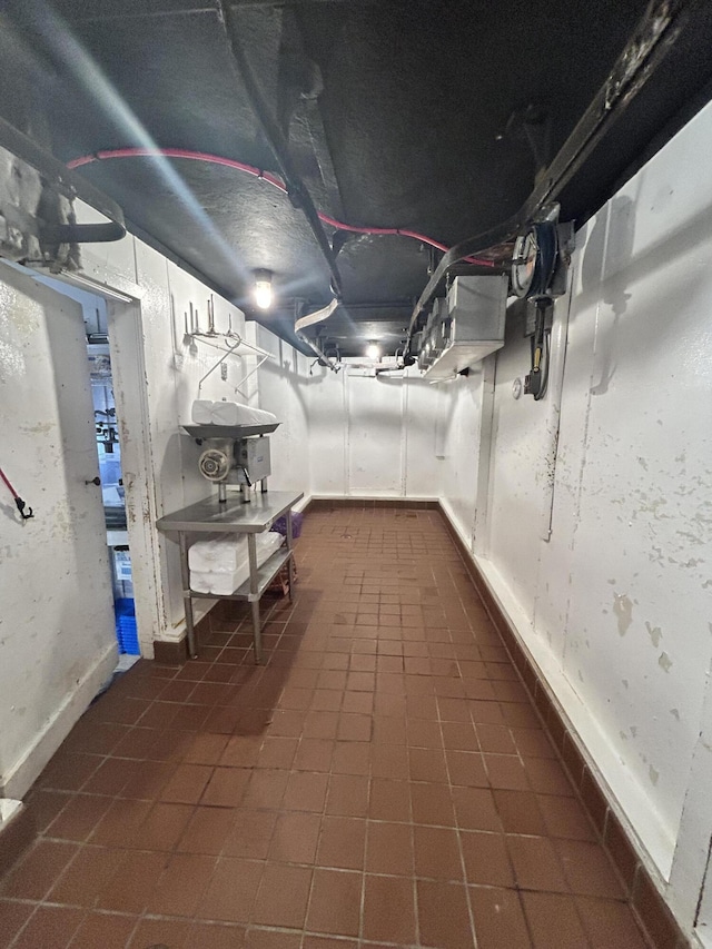 208 New Rd, Arundel, ME 04046 - unfinished basement with baseboards and dark tile patterned flooring