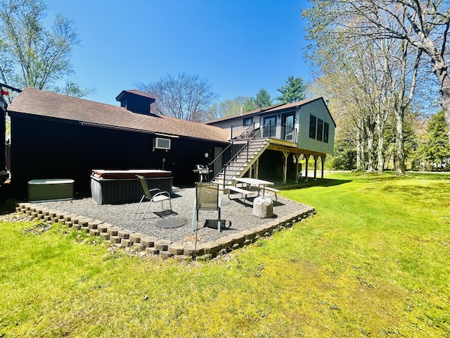 208 New Rd, Arundel, ME 04046 - rear view of property featuring stairway, a wooden deck, a lawn, a patio, and a hot tub