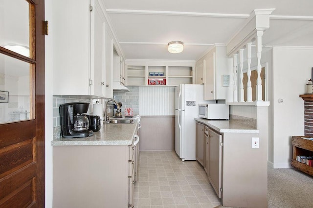688 Kings Hwy, Kennebunkport, ME 04046 - kitchen featuring a sink, white appliances, backsplash, and white cabinets