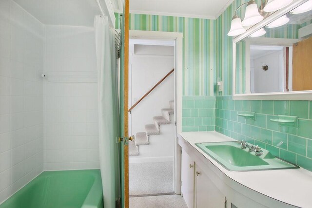 688 Kings Hwy, Kennebunkport, ME 04046 - full bathroom with vanity, wallpapered walls, and shower / bath combo with shower curtain
