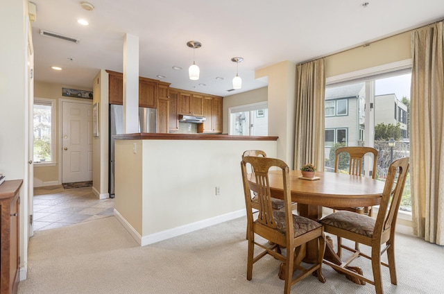 215 High St Unit 101, South Portland, ME 04106 - dining space featuring healthy amount of natural light, baseboards, light carpet, and recessed lighting