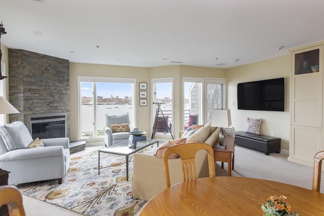 215 High St Unit 101, South Portland, ME 04106 - carpeted living area featuring a stone fireplace