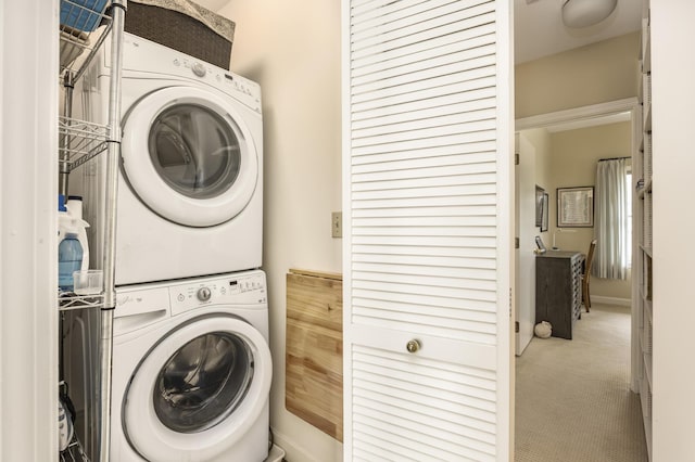 215 High St Unit 101, South Portland, ME 04106 - washroom featuring stacked washer / dryer and carpet