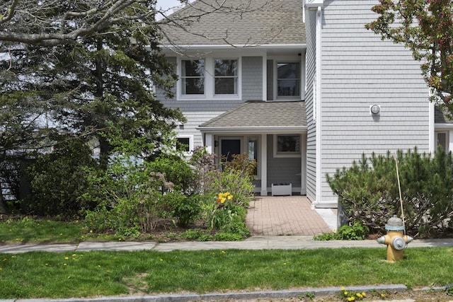 215 High St Unit 101, South Portland, ME 04106 - view of front facade with roof with shingles