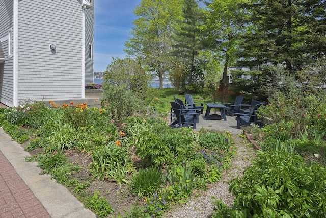 215 High St Unit 101, South Portland, ME 04106 - view of yard with a patio area and an outdoor fire pit