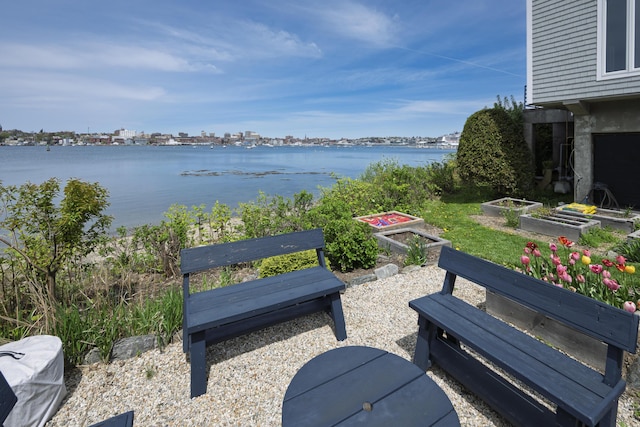 215 High St Unit 101, South Portland, ME 04106 - view of patio with a garden and a water view
