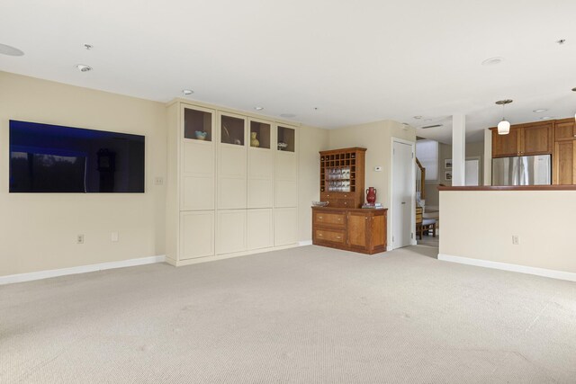 215 High St Unit 101, South Portland, ME 04106 - unfurnished living room with light colored carpet