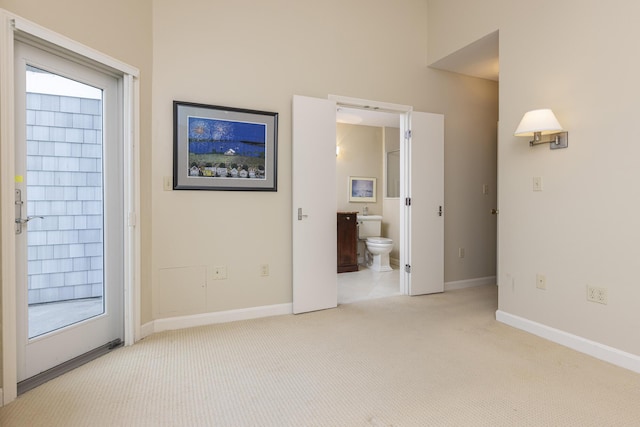 215 High St Unit 101, South Portland, ME 04106 - empty room featuring light carpet and healthy amount of natural light
