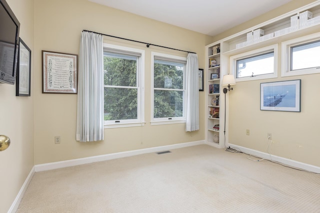 215 High St Unit 101, South Portland, ME 04106 - carpeted empty room with baseboards