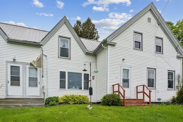 19 Cobbossee Ave, Gardiner, ME 04345 - rear view of property with a yard and metal roof