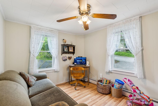 19 Cobbossee Ave, Gardiner, ME 04345 - home office with wood finished floors, ornamental molding, a baseboard heating unit, and ceiling fan