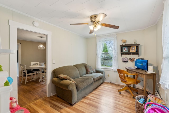 19 Cobbossee Ave, Gardiner, ME 04345 - living room featuring crown molding, light wood finished floors, a ceiling fan, and an office area