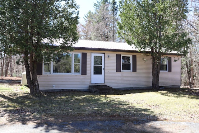113 Pleasant St, Greenville, ME 04441 - view of front facade featuring entry steps, metal roof, and a front yard